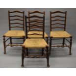 A set of four late 19th/early 20th century ladder back chairs. 49 cm wide.