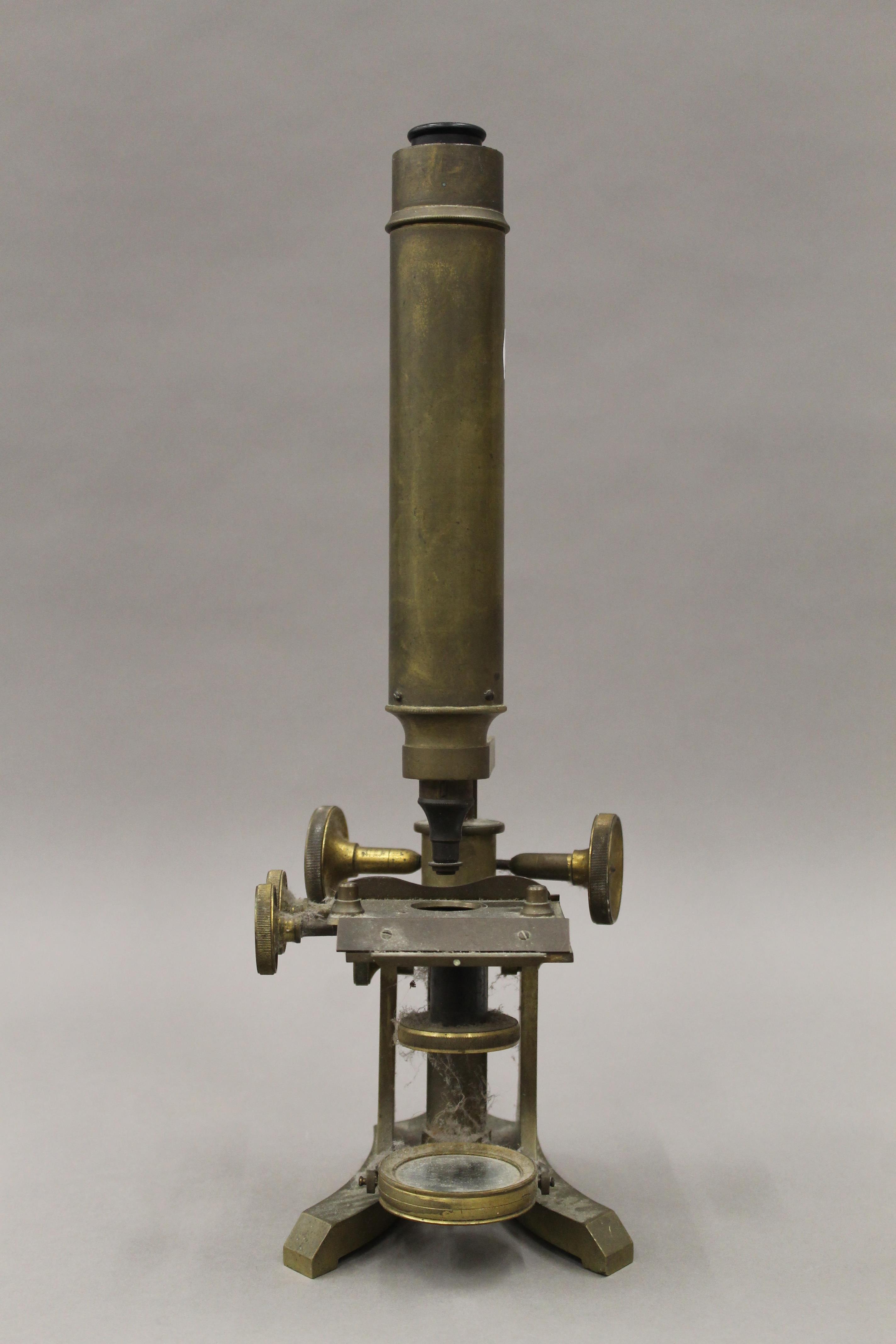 A Victorian brass microscope. 37.5 cm high.