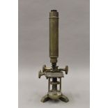 A Victorian brass microscope. 37.5 cm high.