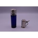 A silver and Bristol blue glass scent bottle and a scent bottle formed as Georgian tankard.