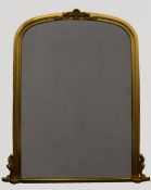 A large gilt framed wall glass. 130 cm wide.