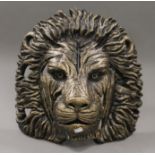 A lion mask sculpture. 42.5 cm high.