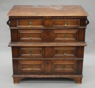 An 18th century oak and mahogany chest of drawers. 91 cm wide.