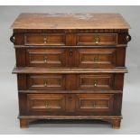 An 18th century oak and mahogany chest of drawers. 91 cm wide.