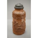 A 19th century salt glazed pewter mounted jar decorated in the round with classical scenes.