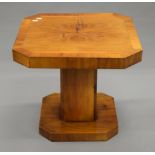 An Art Deco walnut coffee table. 53 cm wide.