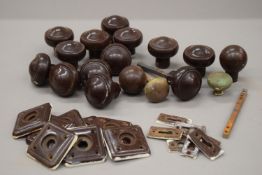 A quantity of vintage bakelite and other door knobs.
