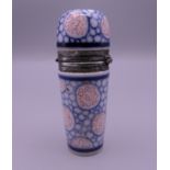 A porcelain and unmarked silver scent bottle. 7.5 cm high.