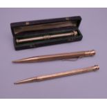 Two 9 ct gold cased propelling pencils and an unmarked example.