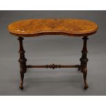 A Victorian walnut kidney shape centre table. 99 cm long.