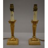 A pair of ormolu columnar table lamps. 31.5 cm high.