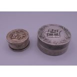 Two Chinese white metal boxes. The largest 6.5 cm diameter.