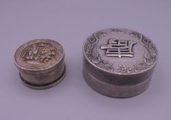Two Chinese white metal boxes. The largest 6.5 cm diameter.