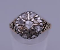A yellow metal/unmarked gold and old cut diamond ring. Ring size N/O. 3.7 grammes total weight.
