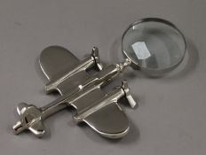 An aeroplane form magnifying glass. 23.5 cm long.