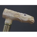 A walking stick with a carved bone handle formed as a horse. 92 cm long.