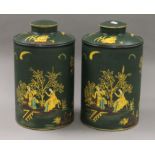 A pair of green toleware tea tins. 39 cm high.