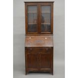 An early 20th century oak bureau bookcase. 72.5 cm wide, 177.5 cm high, 38 cm deep.