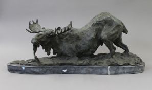 A bronze model of a moose. 61 cm long.