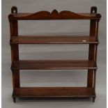 A 19th century mahogany hanging shelves.