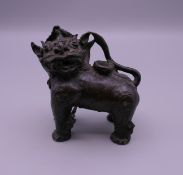A Chinese bronze fo dog water dropper. 7.5 cm high.