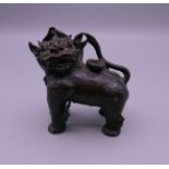 A Chinese bronze fo dog water dropper. 7.5 cm high.