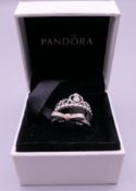 Two silver Pandora rings in a Pandora ring box. Ring size I/J and M/N.
