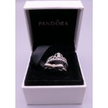 Two silver Pandora rings in a Pandora ring box. Ring size I/J and M/N.