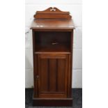 A Victorian walnut pot cupboard.