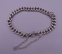 A silver curb bracelet. 19 cm long. 29 grammes.