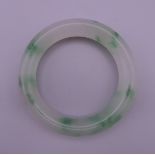 A jade bangle. 7.5 cm exterior diameter, 5.5 cm interior diameter.