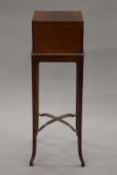 An early 20th century mahogany dressing box on stand with partially fitted interior,