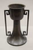 An Oriental silver inlaid bronze vase with twin handles. 26.5 cm high.