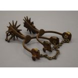 A pair of antique spurs. 10 cm wide.