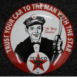 A Texaco enamel sign. 29.5 cm diameter.