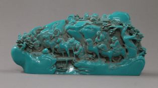A turquoise model of a Chinese boulder carving. 26 cm long.