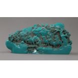 A turquoise model of a Chinese boulder carving. 26 cm long.