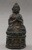 A bronze model of buddha. 28.5 cm high.