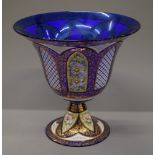 A large florally painted and gilt heightened Murano glass footed centre bowl. 34 cm high.