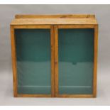 An early 20th century oak glazed bookcase. 88.5 cm wide.