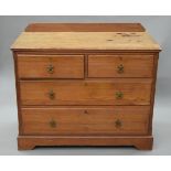 A Victorian pitch pine chest of drawers. 106 cm wide.