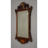 A 19th century inlaid mahogany wall glass. 92.5 cm high.