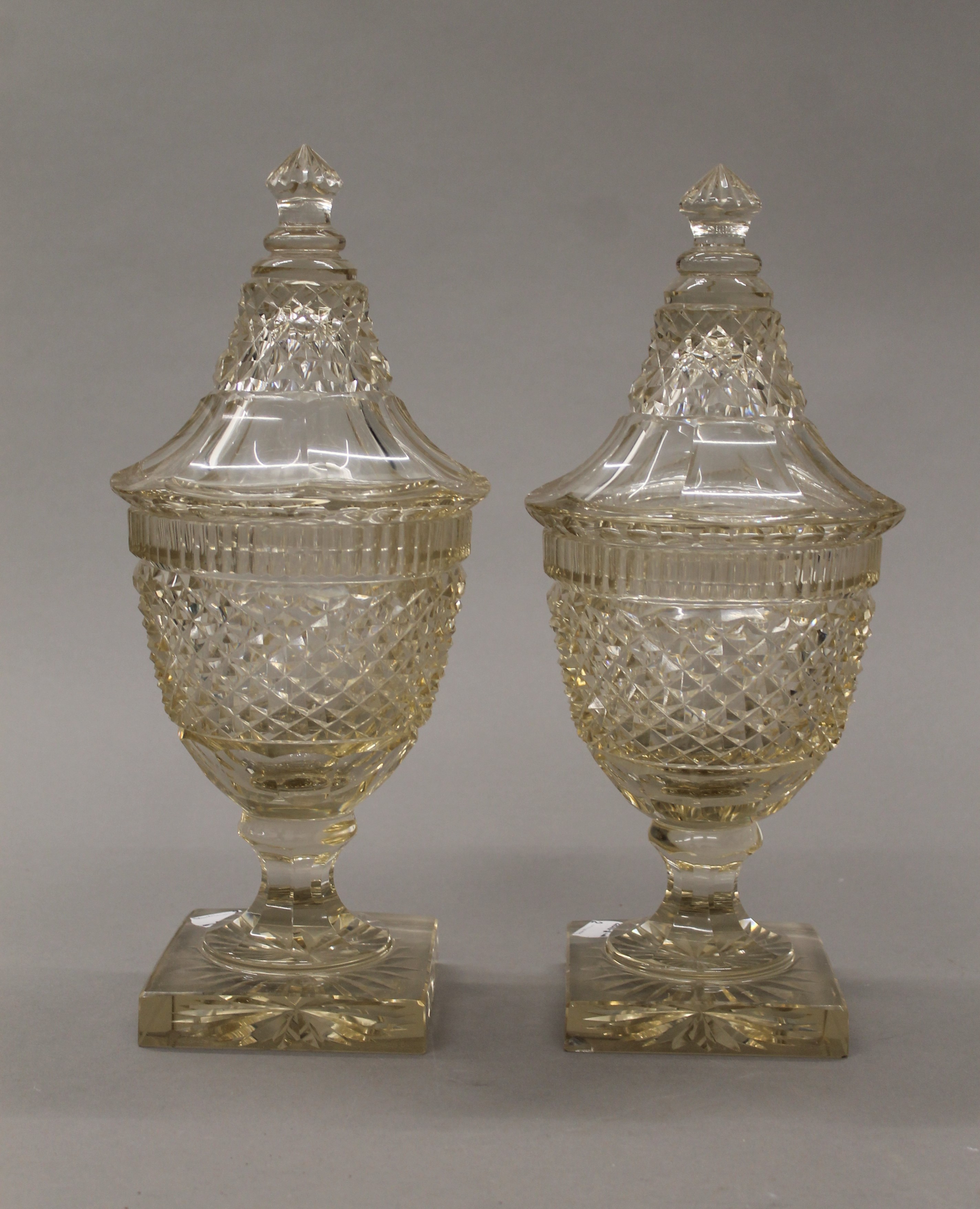 A pair of 19th century cut glass lidded vases, possibly Irish. 31 cm high.