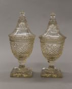 A pair of 19th century cut glass lidded vases, possibly Irish. 31 cm high.