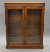 An early 20th century glazed oak bookcase. 94 cm wide.