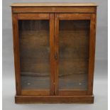 An early 20th century glazed oak bookcase. 94 cm wide.