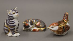 Three Royal Crown Derby porcelain paperweights. The largest 8 cm high.