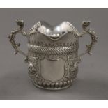 An embossed silver double lipped cream jug. 7 cm high. 89.2 grammes.