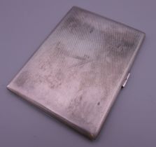 A silver cigarette case, inscribed Sir George Bonner KT to the interior. 11.5 cm wide. 176.