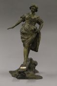 A bronze model of a girl walking on a bridge. 34 cm high.